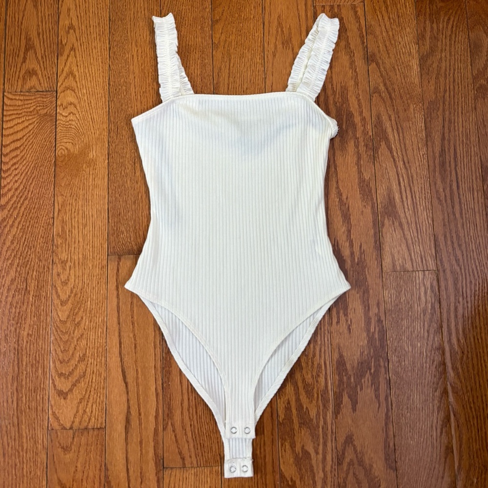 NWOT Cream Ribbed Body Suit with Ruffled Straps